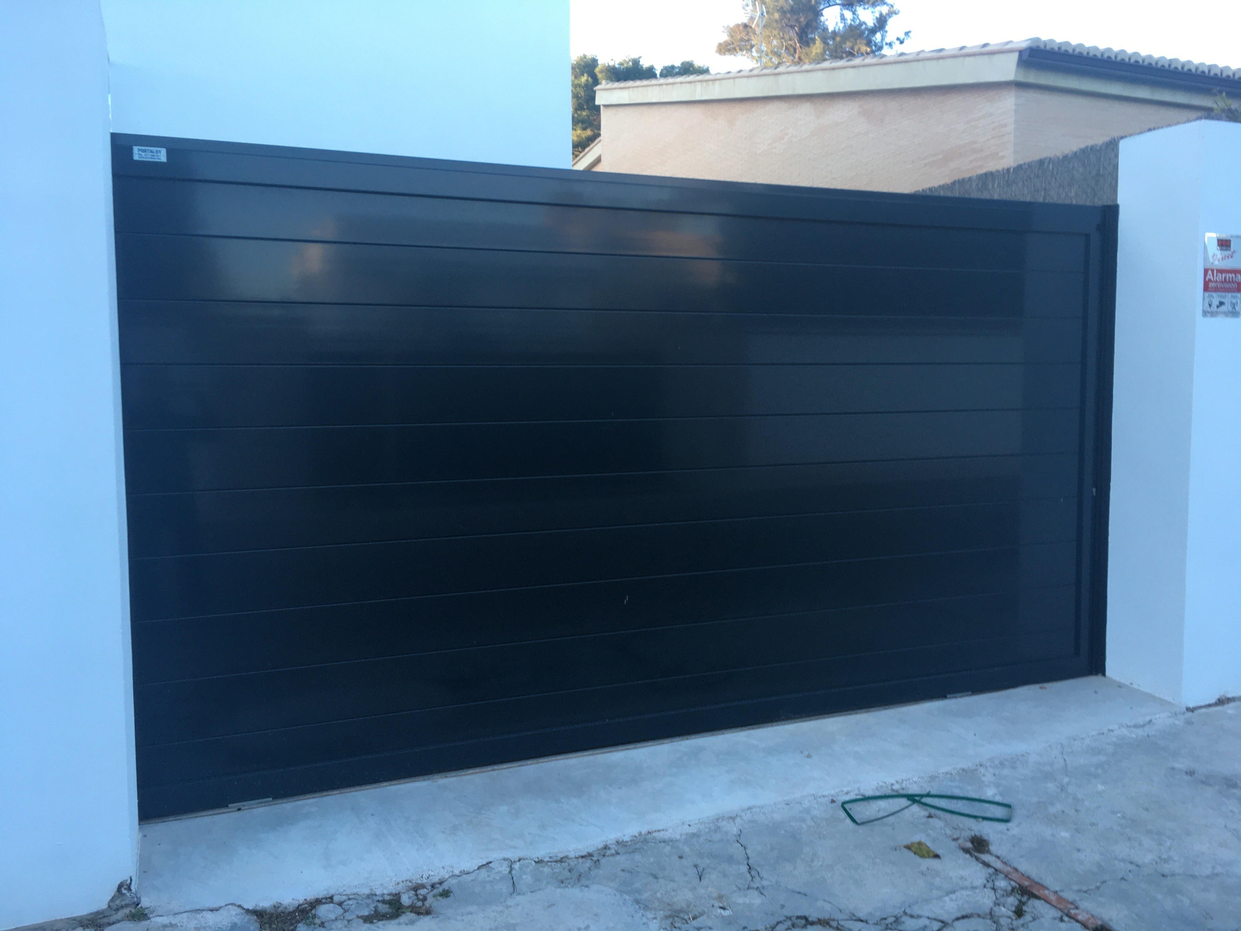 Puertas correderas de panel :: PORTALOY- Fabricación y mantenimiento de