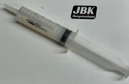 GRASA MOLYKOTE  EM-50L en jeringa.